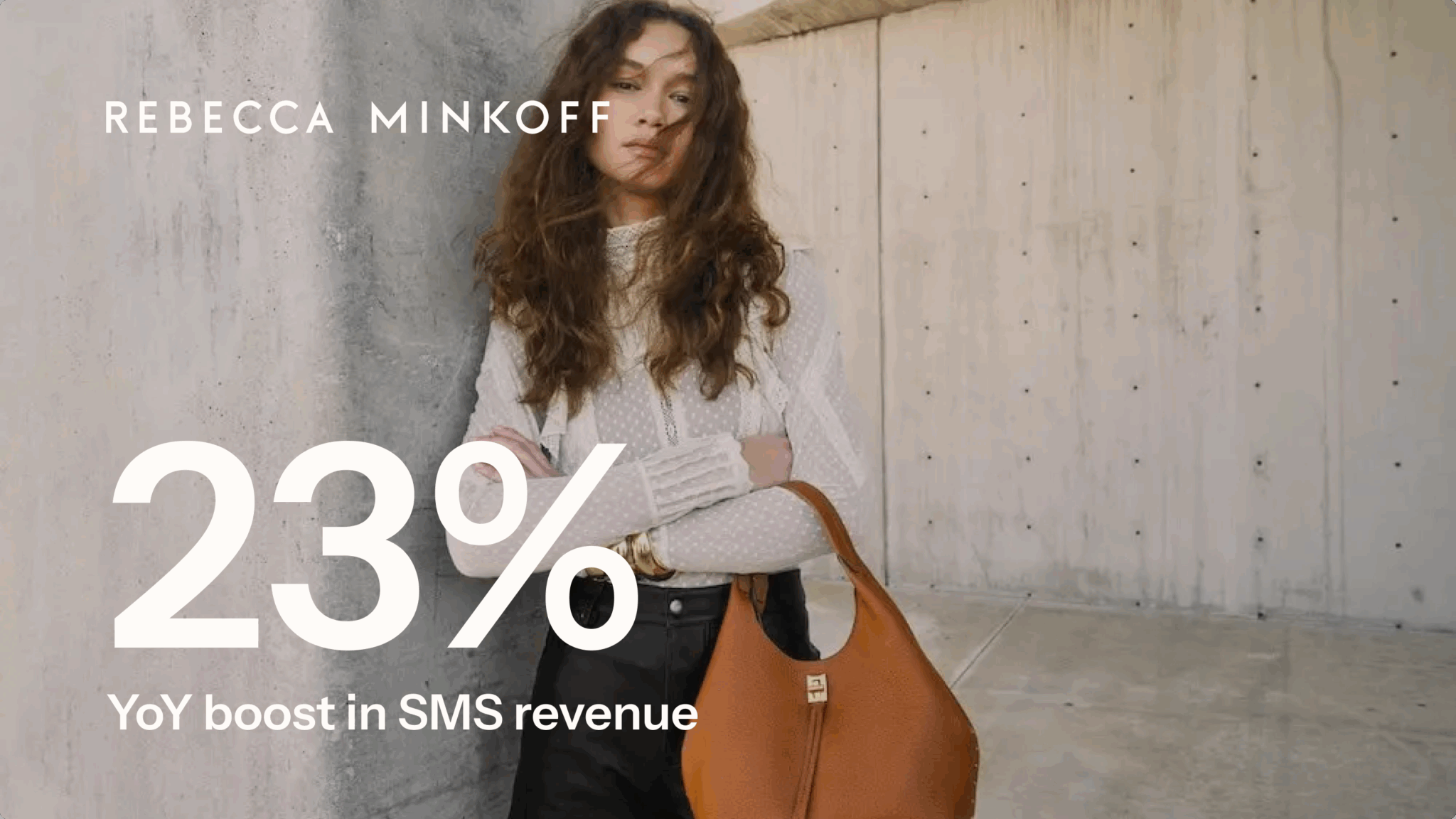 Woman in a white blouse holding a brown handbag, with text "Rebecca Minkoff, 23% YoY boost in SMS revenue.