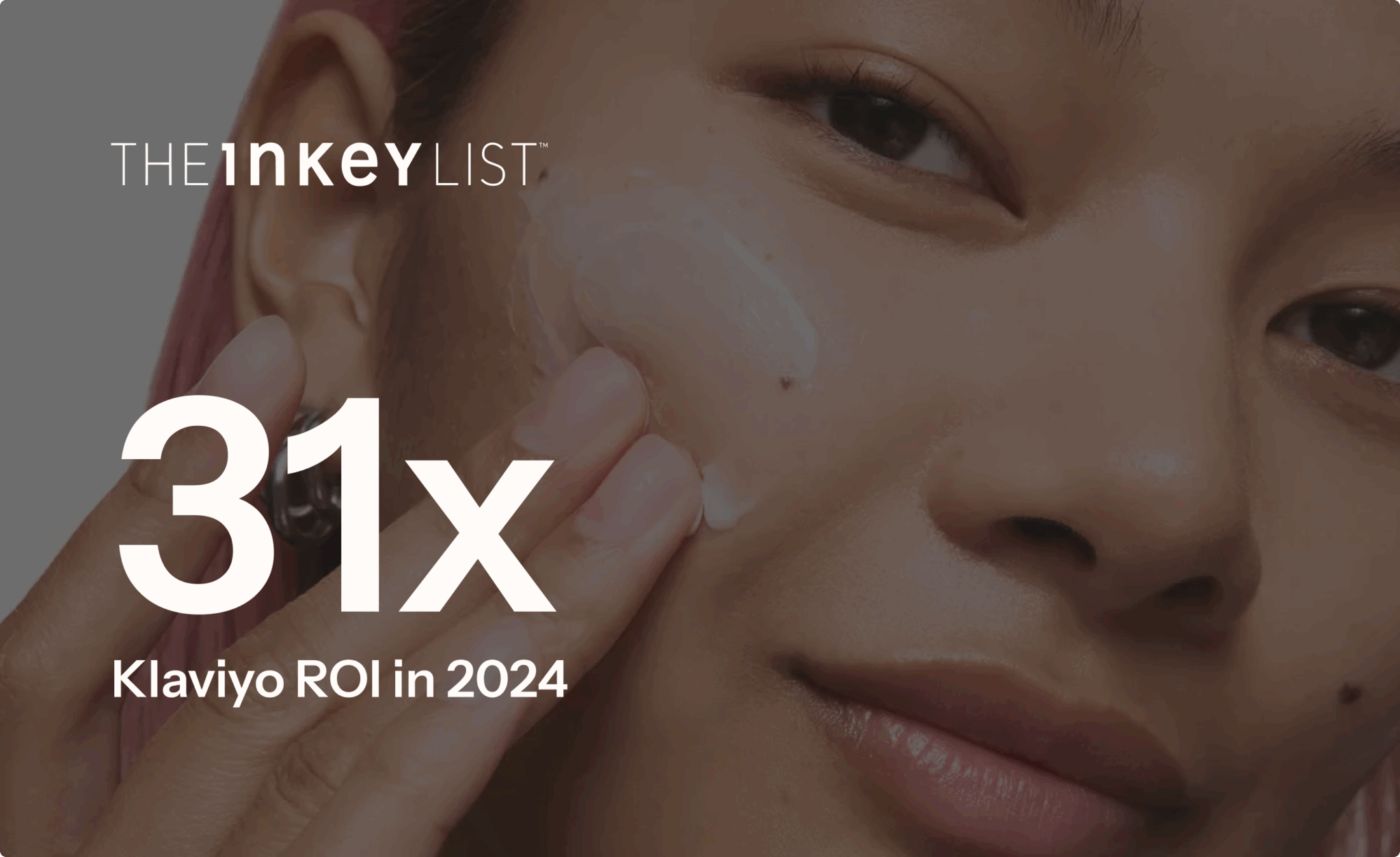 Person applying cream to their face with text overlay: "THE INKEY LIST, 31x Klaviyo ROI in 2024".