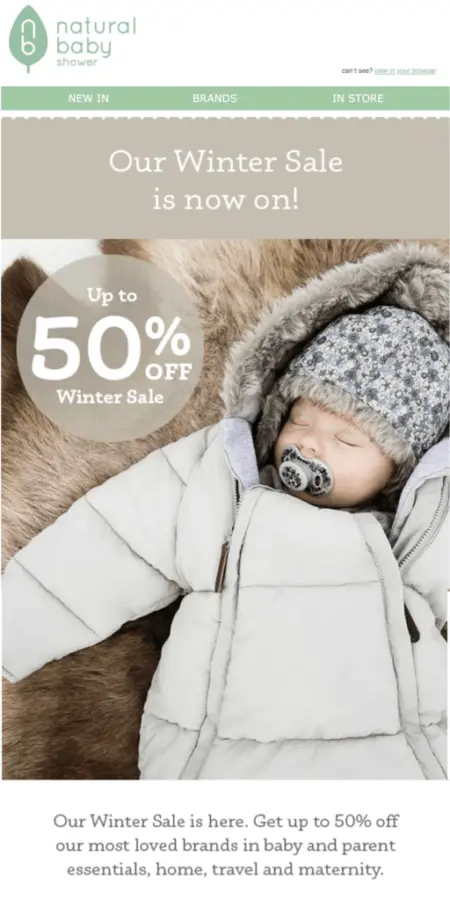 Image shows a Boxing Day marketing email from eco-friendly baby brand Natural Baby Shower, featuring a banner that reads “our winter sale is now on!” The email contains a photo of a baby sleeping in a parka on a fur rug, next to a sticker that reads, “up to 50% off.”