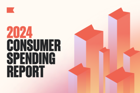 In stacked capital letters, image reads, "2024 consumer spending report." On the right side of the image are several 3D vertical bars, as if in a bar graph, shaped at the top like the Klaviyo flag.