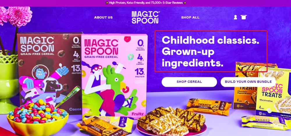 Image shows a screenshot from the homepage of cereal brand Magic Spoon, featuring colorful product shots against a purple background. The website copy reads, “Childhood classics. Grown-up ingredients,” with two CTA buttons underneath: “Shop cereal” and “Build your own bundle.”