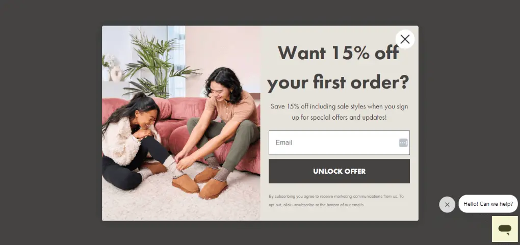 Image shows an email sign-up form on the Bearpaw website, featuring a photo on the left of a mom and her child sitting on a plush couch, trying on the brand’s clogs. On the right is the copy, “Want 15% off your first order? Save 15% off including sale styles when you sign up for special offers and updates!” The form then shows a field where the viewer can type their email address, with a CTA button that reads, “UNLOCK OFFER.”